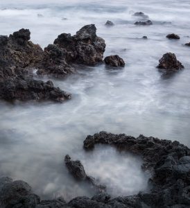 Wave Patterns Amidst Rocks