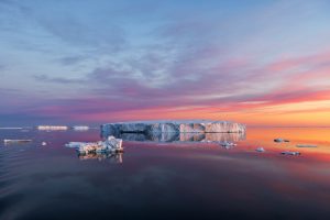 Icebergs Reflected at Sunrise on the Solstice