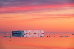Tabular Iceberg with Pink Clouds at Dawn on the Solstice in Weddell Sea