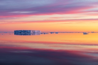Tabular Icebergs Reflected at Sunrise on the Solstice